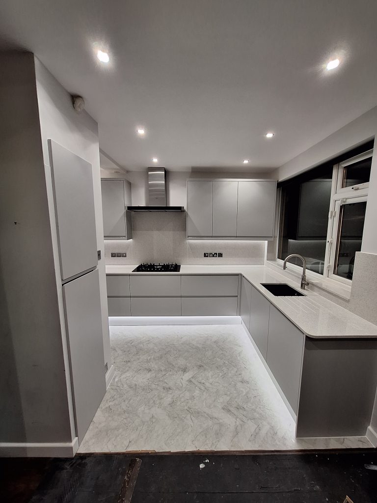 Contemporary grey kitchen with illuminated plinths